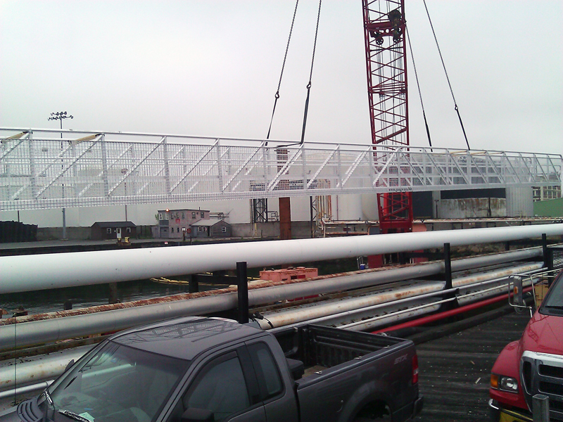 aluminum gangways go between a set of dolphins