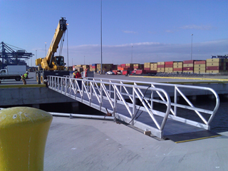 Aluminum gangway from shore to dolphin.