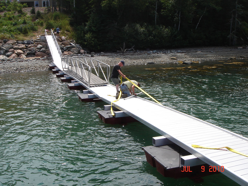 Securing the floating walkway against lateral movement