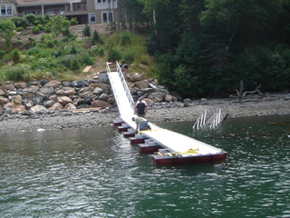 Securing the floating walkway with anchors
