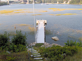 Detail feature showing attachment of pier to cement piling using our J-clamps.
