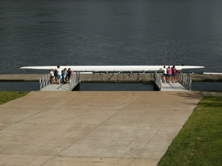 Rowers carrying skull down wide gangways