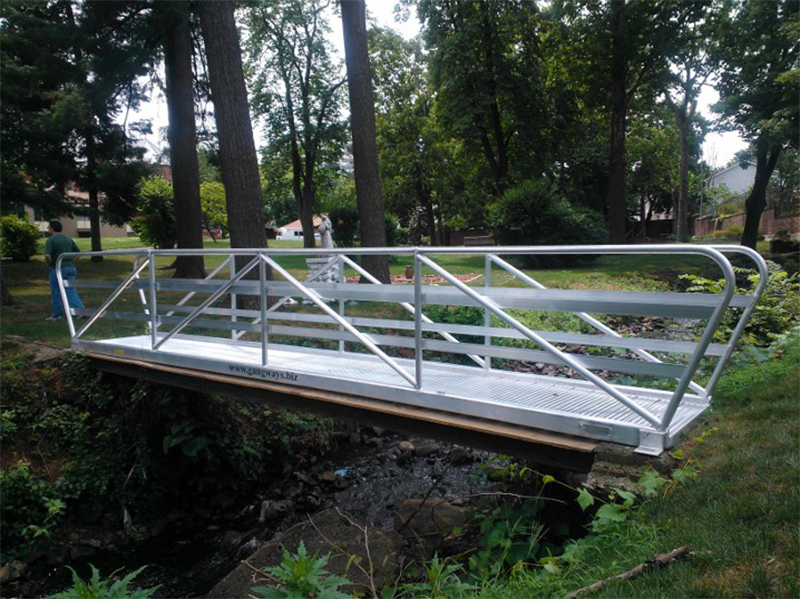 aluminum gangways go between a set of dolphins